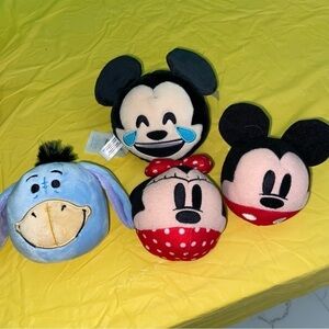 Four Emoji plushes. Mickey, Minnie, reversible Mickey and Pooh’s friend Eeyore.